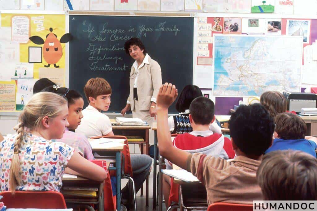 woman standing in front of children